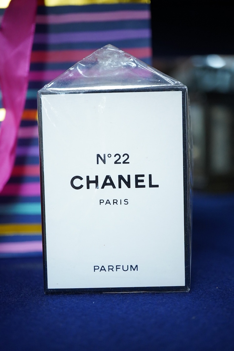 An unopened bottle of Chanel No.22 perfume, together with a boxed Paloma Picasso lipstick